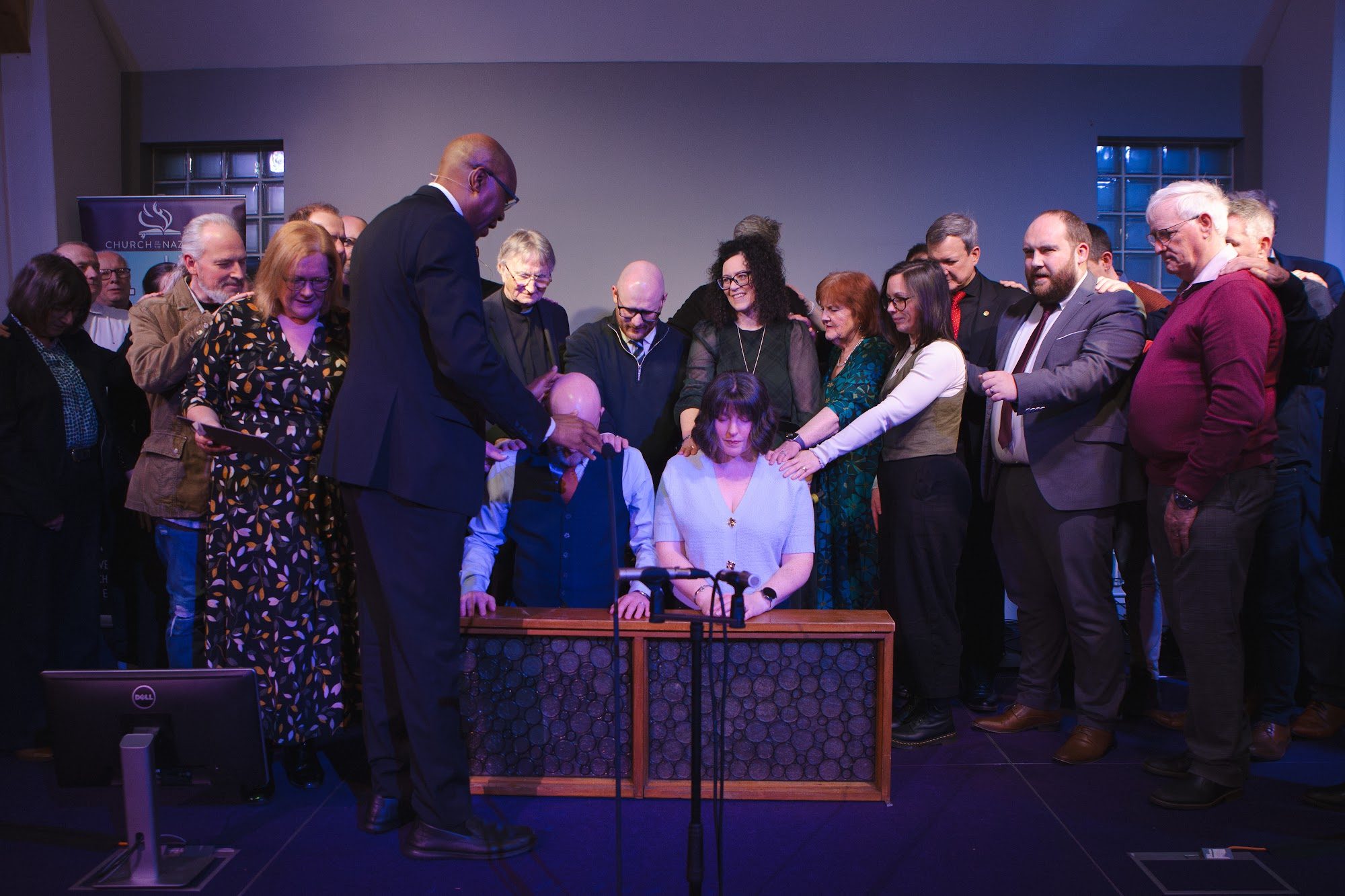 The district praying together during an ordination at District Assembly 2026